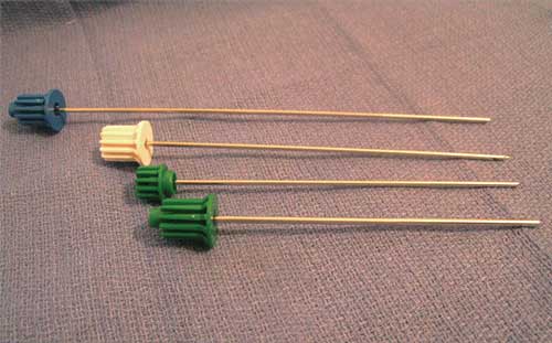 Photograph of needles and drill tips used during a bone biopsy