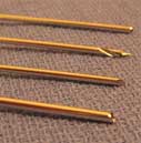 Photograph of needles and drill tips used during a bone biopsy